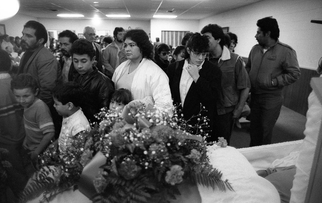Mourners file past Mario Bravo's casket on December 1, 1987.
