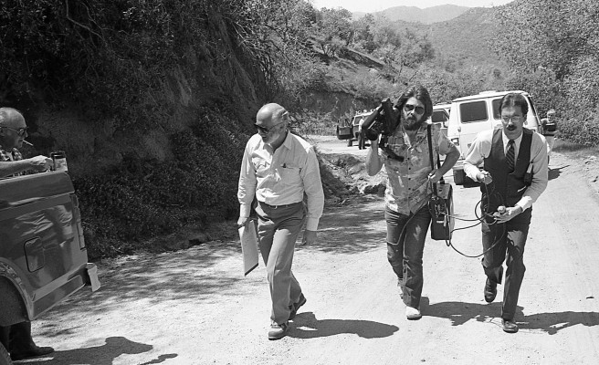 KERO-TV bakersfield reporter Carl Schweitzer and cameraman Rob Bishop follow defense attorney Timothy Lemucchi at the murder scene where William Robert Tyack shot and killed two homosexual men near Glennville California. They were among the media on hand the day the trial was moved to the scene.